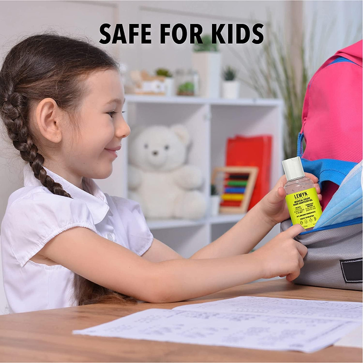 Safe for kids - child using Lemyn Organics hand sanitizer at a desk